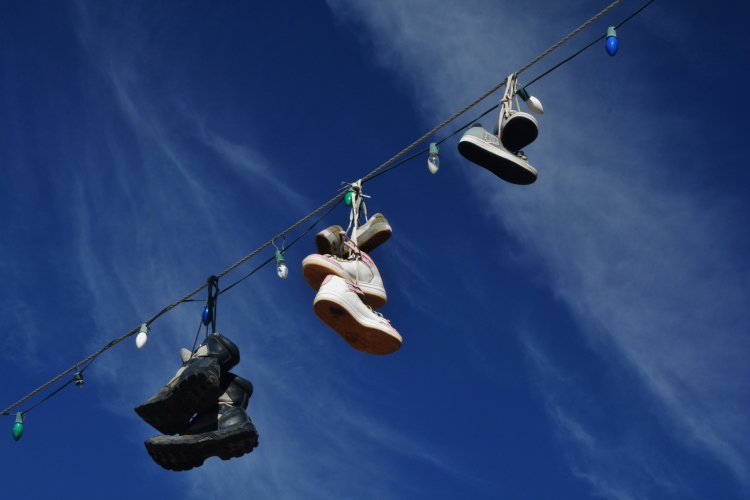 shoes hanging from wire